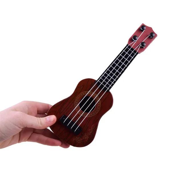 Gyerek mini ukulele, 25,5 cm, 4 nylon húr, fa hatású műanyag, 18 hó+